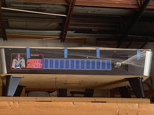 Coin operated air hockey